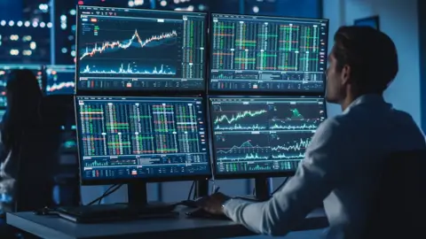 Getty Images Stock trader at desk