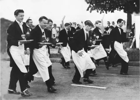 Getty Images Waiters racing