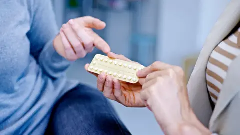 Getty Images Doctor discussing oral contraception with a patient