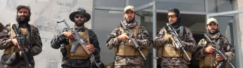 Reuters Taliban forces stand guard a day after the withdrawal of US troops from Hamid Karzai international airport in Kabul