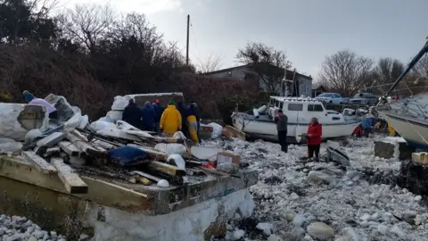 Jonathan Fox The clean-up operation at the marina in Holyhead