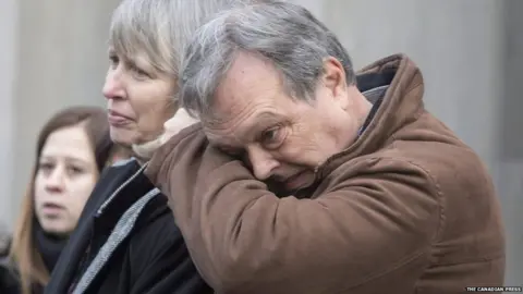 The Canadian Press Clayton Babcock (right) stands next to his wife Linda