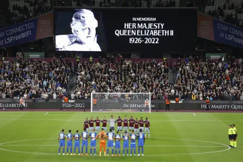 Peter Cziborra/Reuters Players observe a minutes silence