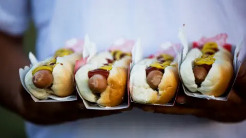 Getty Images Hot dogs with mustard and ketchup,