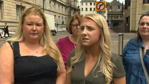 Healthcare support worker Sophie Round (centre)