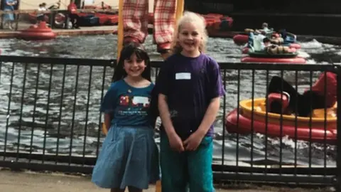 Alamy Lucy Elliott with her friend Christine Sansford at the park as a child