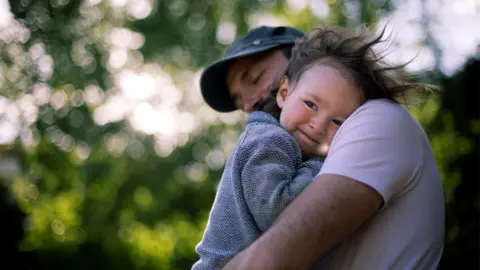 Getty Images Parent with child