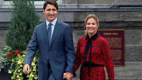 Reuters Canadian Prime Minister Justin Trudeau holding hands with wife Sophie Grégoire Trudeau at Rideau Hall in September