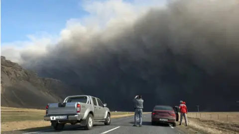 Getty Images Motorists take pictures of Iceland's Eyjafjallajokull volcano in 2010