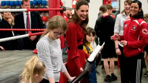 Getty Images Princess of Wales takes part in a group activity during a visit with Prince William at Bulldogs Development Centre in Port Talbot