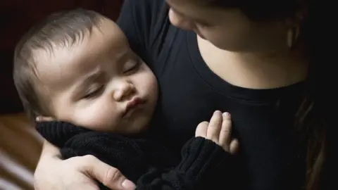 Getty Images A teenage mother with her baby