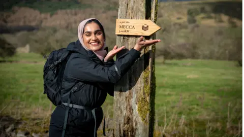 Muslim Hikers Signs pointing to Mecca