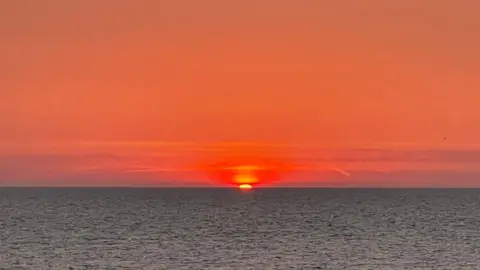 Weather watchers/Richard Red skies at sunrise in Aldeburgh, Suffolk.