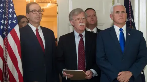 Getty Images John Bolton, centre, Mr Trump's newest National Security Advisor