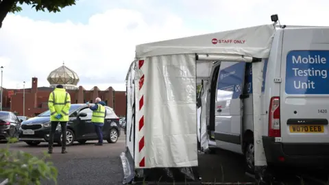 PA Media A Covid mobile testing unit in the car park of Glasgow Central Mosque