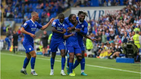 Getty Images Romaine Sawyers celebrates scoring the first goal for Cardiff City FC during the Sky Bet Championship between Cardiff City and Norwich City at Cardiff City Stadium on July 30, 2022 in Cardiff, United Kingdom