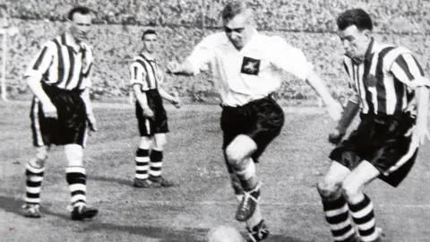 Club archive Robert 'Jock' Haugh is pictured on the right