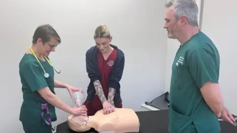 United Lincolnshire Hopsitals NHS Trust Pilgrim Hospital staff perform CPR on a mannequin