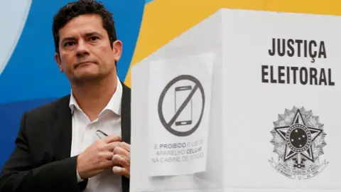 Reuters Brazilian federal Judge Sergio Moro, casts his vote in Curitiba, Brazil October 7, 2018