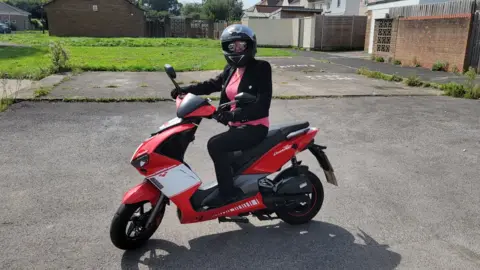 Andrew Marshall Doreen Marshall on a moped