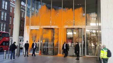 Just Stop Oil Orange paint sprayed on the News Corp headquarters