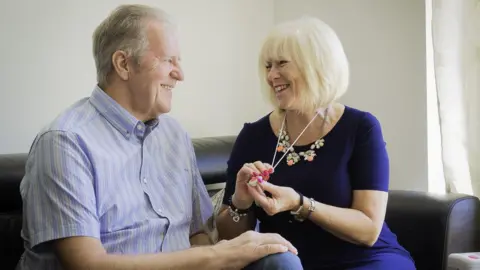 Doug Harman A couple using a pendant alarm