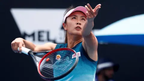 Reuters China's Peng Shuai serves during a match against Canada's Eugenie Bouchard in January 2019