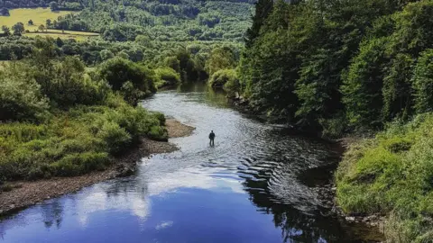 Tom Whittaker  Fisherman in the River Usk