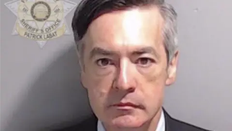 Fulton County Sheriff's Office In this handout provided by the Fulton County Sheriff's Office, former Trump lawyer Kenneth Chesebro poses for his booking photo on August 23, 2023 in Atlanta, Georgia.