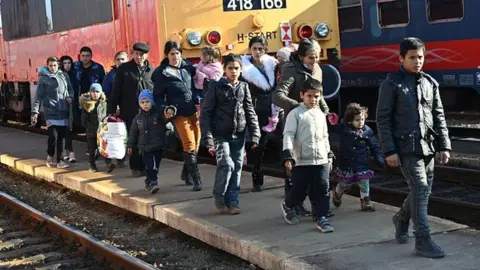 Getty Images Ukrainian refugees arrive from their homeland at Zahonyi railway station close to the Hungarian-Ukrainian border