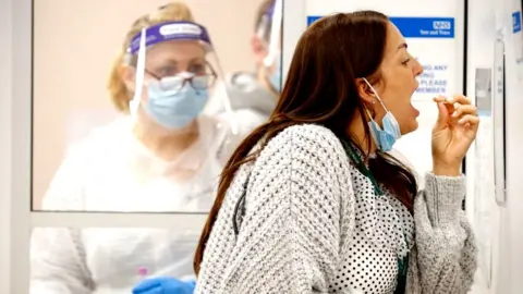 Getty Images woman takes Covid PCR test