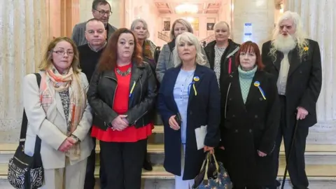 PACEMAKER Margaret McGuckin from the group SAVIA pictured with survivors of abuse who went to Stormont on Friday