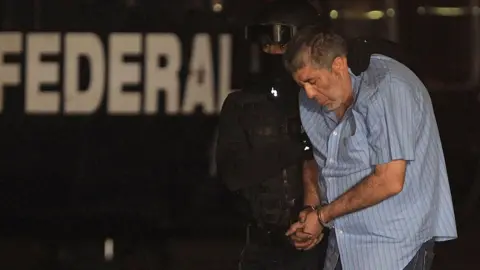 Anadolu Agency Juarez Cartel boss Vicente Carrillo Fuentes, alias El Viceroy, brother of the late Mexican drug lord Amado Carrillo, is escorted to a helicopter after his arrest at the hangar of the Attorney General of Mexico on October 09, 2014 in Mexico City.