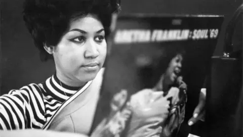 Getty Images Aretha Franklin holds a copy of her Soul 69 album in New York City