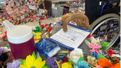 Covid tests on a table surrounded by flowers