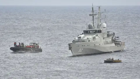 Getty Images An Australian Navy vessel intercepts a boat of asylum seekers in 2012