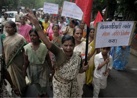 Getty Images Domestic workers protested in Mumbai against actor Shiney Ahuja, who was allegedly raped his 18-year-old maid.