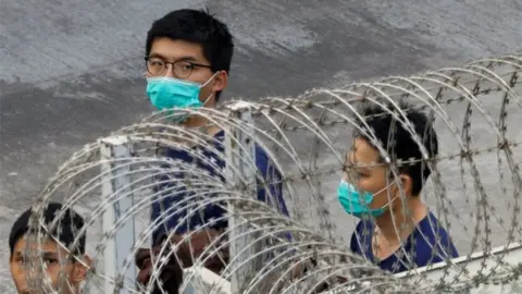 Reuters Pro-democracy activist Joshua Wong is seen in Lai Chi Kok Reception Centre after jailed for unauthorised assembly near the police headquarters during last year"s anti-government protests in Hong Kong, China December 3, 2020.