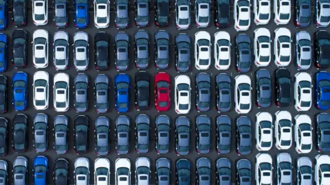 Getty Images Large number of cars in a car park