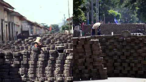 Getty Images A man crouches behind a barricade and points a rifle in 1979/ Local residents walk between barricades in Masaya, some 35km from Managua on June 20, 2018.