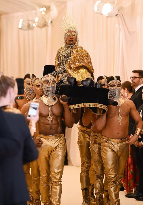 Getty Images Billy Porter being carried into the Met Gala
