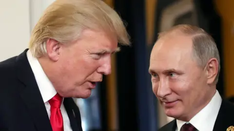 EPA Russian President Vladimir Putin (R) and US President Donald J. Trump (L) talk at a summit in Da Nang, Vietnam, (11 November 2017)