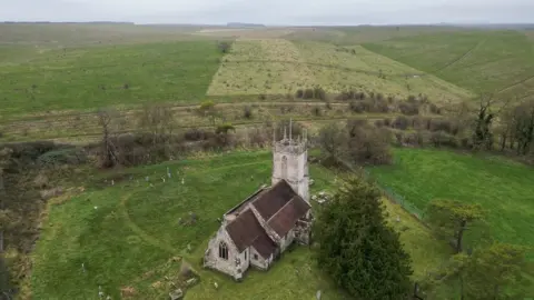 BBC A drone shot of St Giles Church in isolation on Salisbury Plain