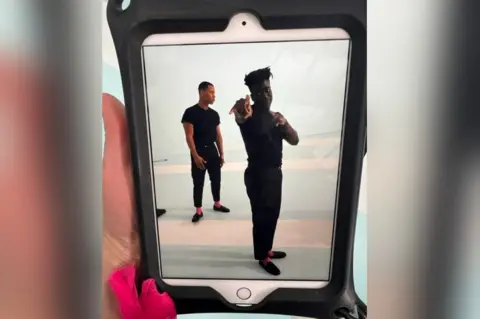 Gustave Die Gustave Die and a colleague on an iPad