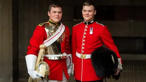 PA Guardsman Thomas Dell of the Grenadier Guards (right) and his twin brother Trooper Ben Dell of the Household Cavalry,