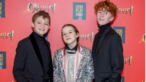 Leeds playhouse  Hughie pictured with his Oliver! castmates Felix Holt and Noah Walton