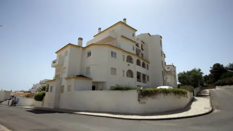 PA Media The apartment block in Luz in the Algarve, Portugal, where Madeleine McCann went missing