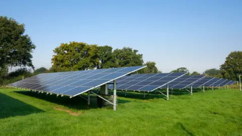 Solar panels in a field generating electricity near Churchill in North Somerset