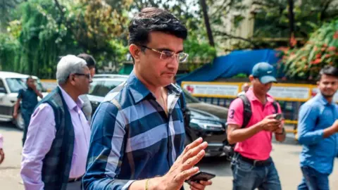 Getty Images Former cricket captain Sourav Ganguly (C) gestures as he arrives at the Board of Control for Cricket in India (BCCI) headquarters at Wankhede stadium to file nomination for the board's elections in Mumbai on October 14, 2019.
