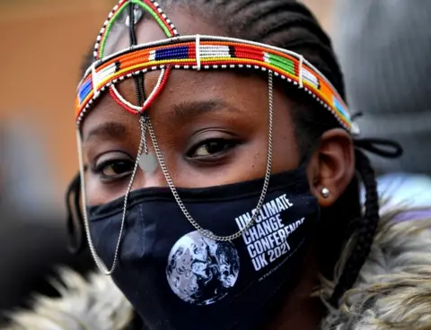 Getty Images Lady in COP26 mask